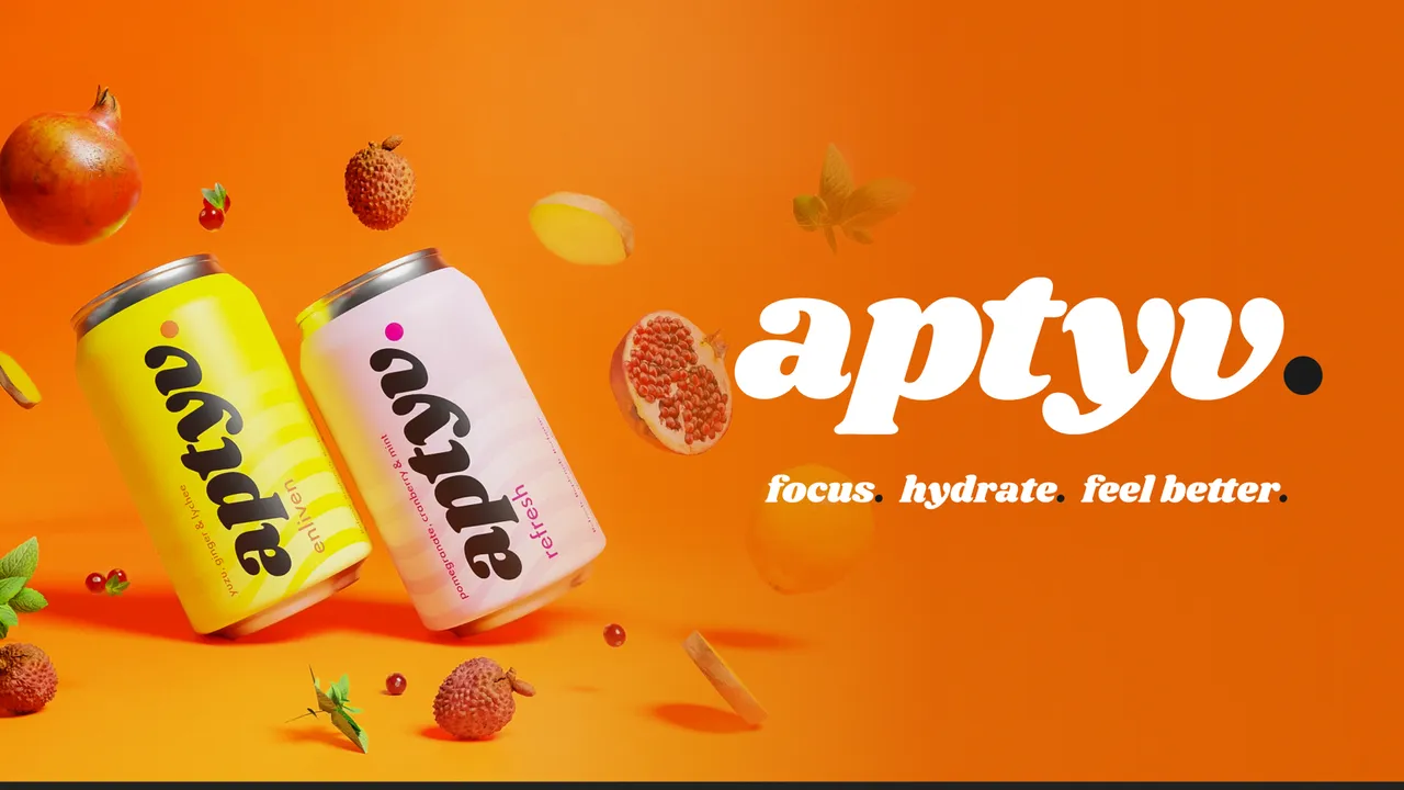 APTYV drink cans and fruit on an orange background.